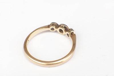 Lot 280 - A 22CT YELLOW GOLD RING AND A 9CT GOLD PLATED THREE STONE RING
