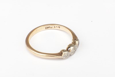 Lot 280 - A 22CT YELLOW GOLD RING AND A 9CT GOLD PLATED THREE STONE RING