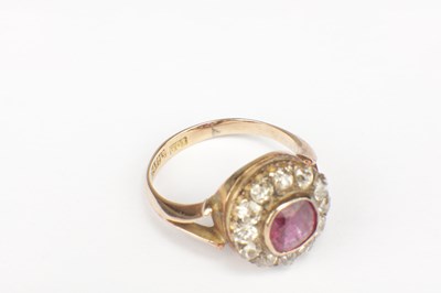Lot 257 - A RUBY AND DIAMOND 9CT GOLD CLUSTER RING