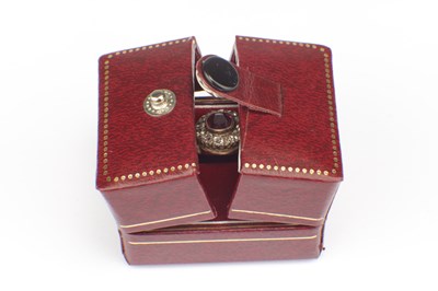 Lot 257 - A RUBY AND DIAMOND 9CT GOLD CLUSTER RING