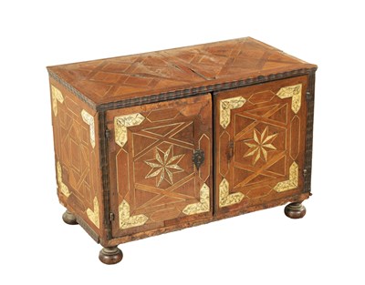 Lot 1235 - A 17TH CENTURY PARQUETRY INLAID WALNUT AND IVORY ITALIAN TABLE CABINET