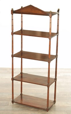 Lot 1148 - A SET OF FIVE TIER REGENCY MAHOGANY SHELVES