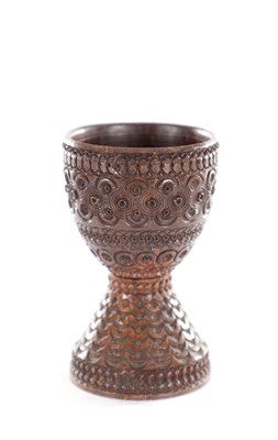 Lot 535 - A 19TH CENTURY CARVED CALQUILER NUT EGG CUP