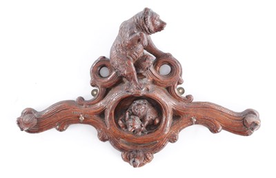 Lot 724 - A 19TH CENTURY FINELY CARVED BLACK FOREST COAT HANGER