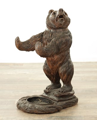 Lot 729 - A 19TH CENTURY CARVED LINDEN WOOD BLACK FOREST BEAR STICK STAND