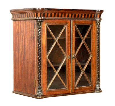 Lot 1295 - A LATE GEORGIAN CAMPHOR WOOD AND BRASS INLAID CAMPAIGN HANGING CABINET