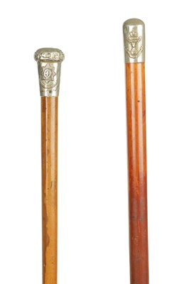 Lot 789 - TWO EARLY 20TH CENTURY SILVER TOPPED REGIMENTAL MALACCA WALKING STICKS