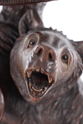 Lot 740 - A GOOD 19TH CENTURY CARVED LINDEN WOOD BLACKFOREST BEAR PIANO STOOL