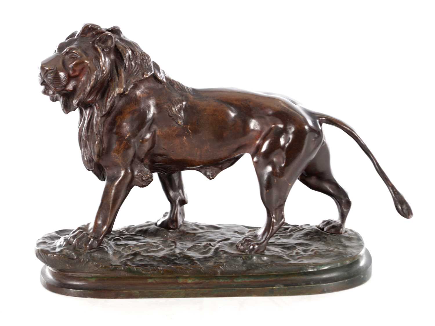 Lot 661 - A 19TH CENTURY PATINATED BRONZE SCULPTURE OF A LION