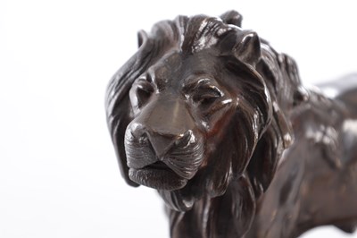 Lot 661 - A 19TH CENTURY PATINATED BRONZE SCULPTURE OF A LION