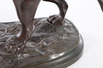 Lot 661 - A 19TH CENTURY PATINATED BRONZE SCULPTURE OF A LION