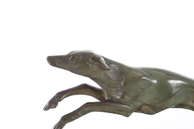 Lot 609 - A STYLISH ART DECO PATINATED BRONZE SCULPTURE DEPICTING A DANCING GIRL AND BORZOI