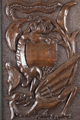 Lot 743 - A PAIR OF ARTS AND CRAFTS CARVED OAK HANGING PANELS