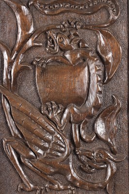 Lot 743 - A PAIR OF ARTS AND CRAFTS CARVED OAK HANGING PANELS