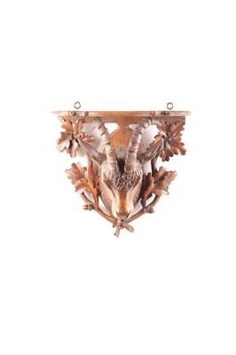 Lot 719 - A 19TH CENTURY CARVED WALNUT BLACK FOREST WALL BRACKET