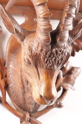 Lot 719 - A 19TH CENTURY CARVED WALNUT BLACK FOREST WALL BRACKET