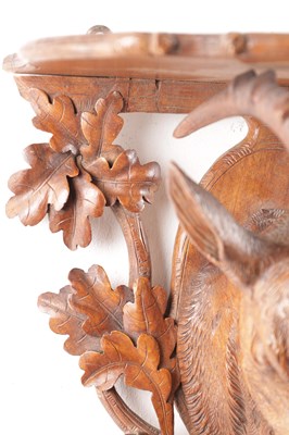 Lot 719 - A 19TH CENTURY CARVED WALNUT BLACK FOREST WALL BRACKET