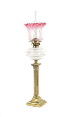 Lot 669 - A VICTORIAN CRANBERRY GLASS OIL LAMP
