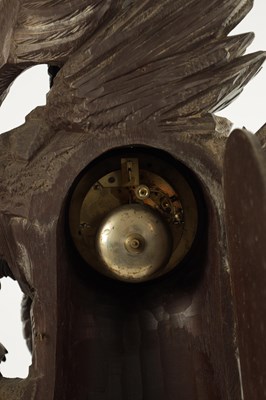 Lot 977 - A 19TH CENTURY BLACK FOREST CARVED THREE PIECE CLOCK GARNITURE