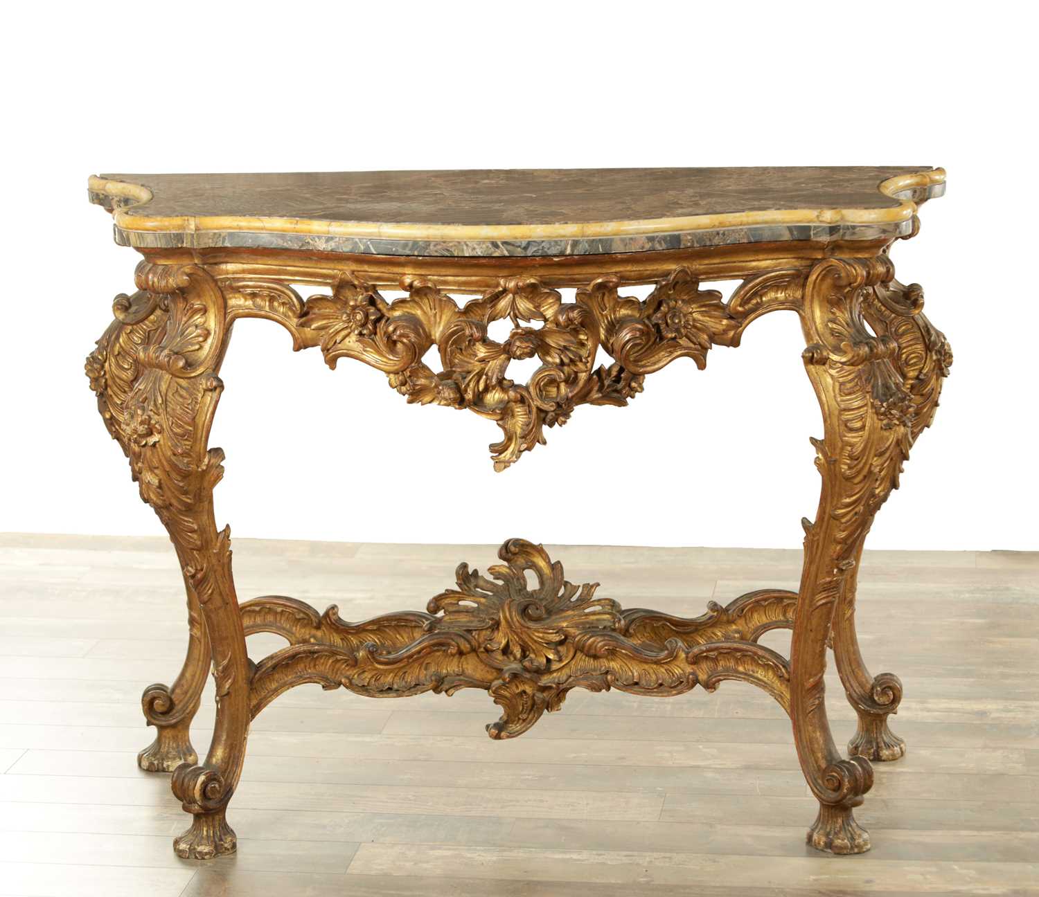 Lot 1275 - A 19TH CENTURY FRENCH CARVED GILTWOOD SERPENTINE SHAPED CONSOLE TABLE