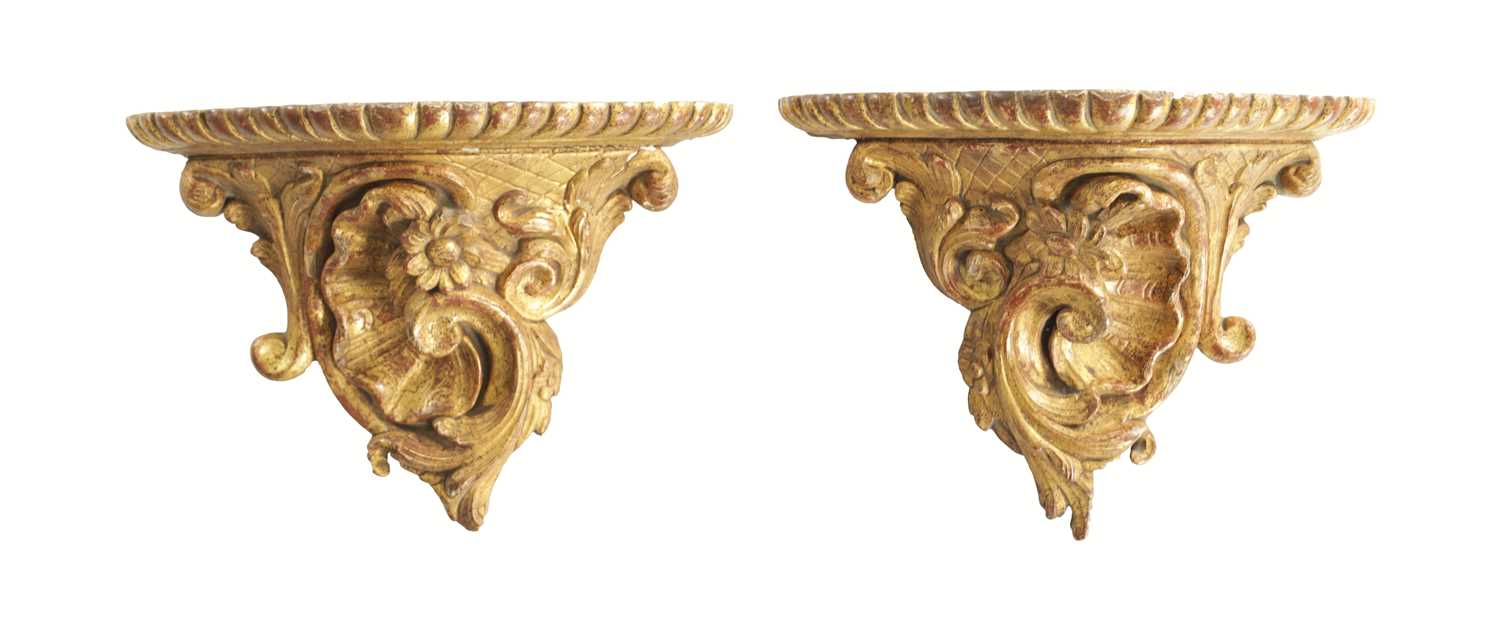 Lot 709 - A PAIR OF 18TH CENTURY CARVED GILTWOOD HANGING BRACKETS