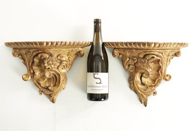 Lot 709 - A PAIR OF 18TH CENTURY CARVED GILTWOOD HANGING BRACKETS