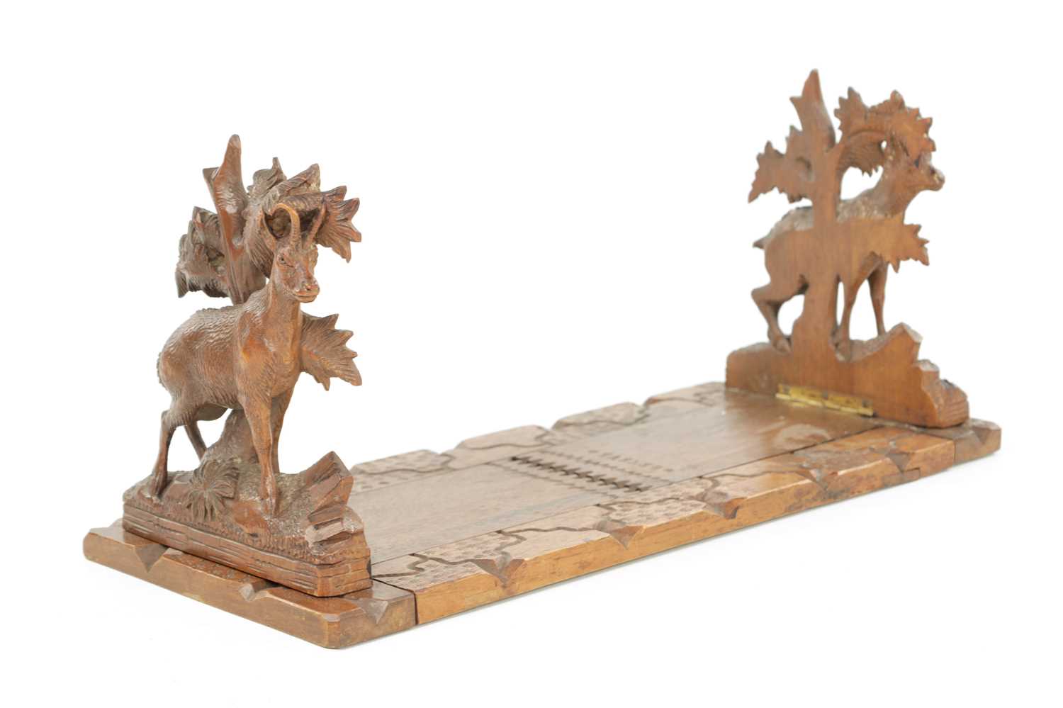 Lot 745 - A 19TH CENTURY CARVED LINDEN WOOD BLACK FOREST ADJUSTABLE BOOK REST