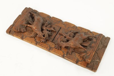 Lot 745 - A 19TH CENTURY CARVED LINDEN WOOD BLACK FOREST ADJUSTABLE BOOK REST