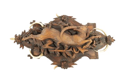 Lot 741 - A 19TH CENTURY CARVED LINDEN WOOD BLACK FOREST HANGING PLAQUE