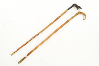 Lot 805 - TWO LATE 19TH CENTURY CARVED HORN WALKING STICKS