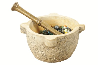 Lot 496 - A CARVED STONE MORTAR AND BELL METAL PESTLE