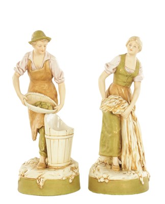 Lot A PAIR OF 19TH/20TH CENTURY ROYAL DUX PORECELAIN FIGURES