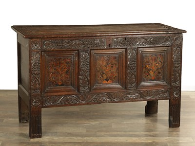 Lot A 17TH CENTURY YORKSHIRE CARVED OAK AND MARQUETRY PANELLED COFFER