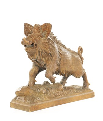 Lot AN EARLY 20TH CENTURY BLACK FOREST CARVED BOAR