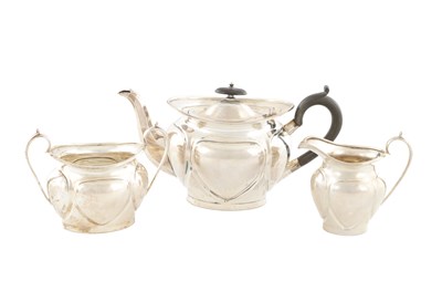 Lot AN EARLY 20TH CENTURY THREE PIECE TEA SERVICE