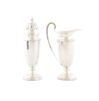 Lot A 20TH CENTURY SILVER CASED CREAM JUG AND SUGAR CASTER SET
