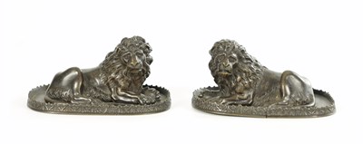 Lot A PAIR OF REGENCY PATINATED BRONZE LION PAPER WEIGHTS