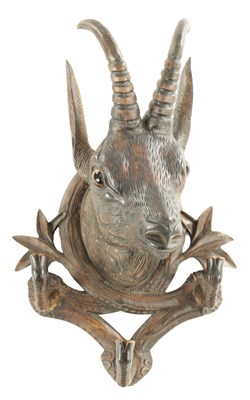 Lot A LATE 19TH CENTURY CARVED BLACK FOREST COAT RACK