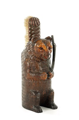 Lot A 19TH CENTURY BLACK FOREST CARVED BRUSH STAND