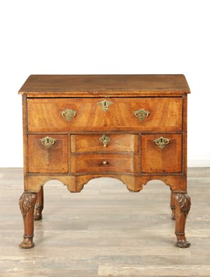 Lot AN UNUSUAL WILLIAM AND MARY FIGURED WALNUT KNEEHOLE DESK