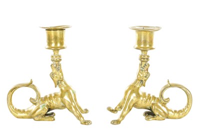 Lot A PAIR OF 19TH CENTURY BRASS DRAGON-FORM CANDLESTICKS