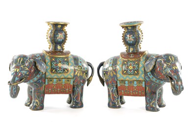 Lot A PAIR OF 19TH CENTURY CHINESE CLOISONNE ELEPHANT CANDLESTICKS