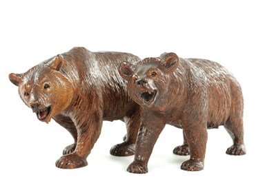 Lot A PAIR OF EARLY 20TH CENTURY BLACK FOREST CARVED BEARS