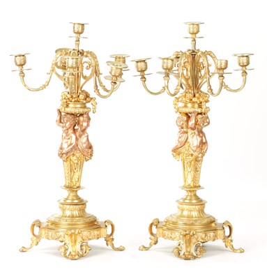 Lot A PAIR OF 19TH CENTURY FRENCH GILT BRONZE FIGURAL FIVE BRANCH CANDELABRA