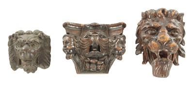 Lot A COLLECTION OF THREE CARVED LION HEAD MOUNTS