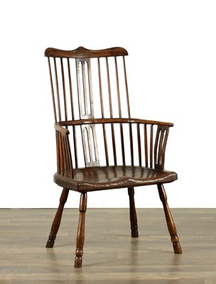 Lot AN OVER-SIZED 18TH CENTURY ASH AND ELM COMB BACK WINDSOR CHAIR