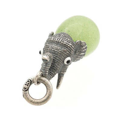 Lot AN EARLY 20TH CENTURY RUSSIAN SILVER AND NEPHRITE ELEPHANT FORM CHARM