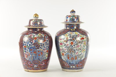 Lot A NEAR PAIR OF 18TH CENTURY CHINESE BLUE AND WHITE BULBOUS VASES AND COVERS LATER DECORATED