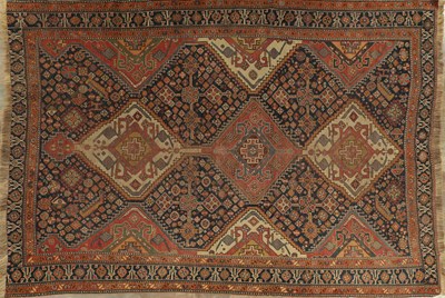 Lot AN ANTIQUE TRIBAL QASHQAI RUG