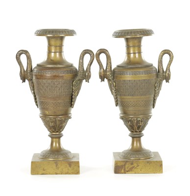 Lot A PAIR OF 19TH CENTURY BRONZE URNS